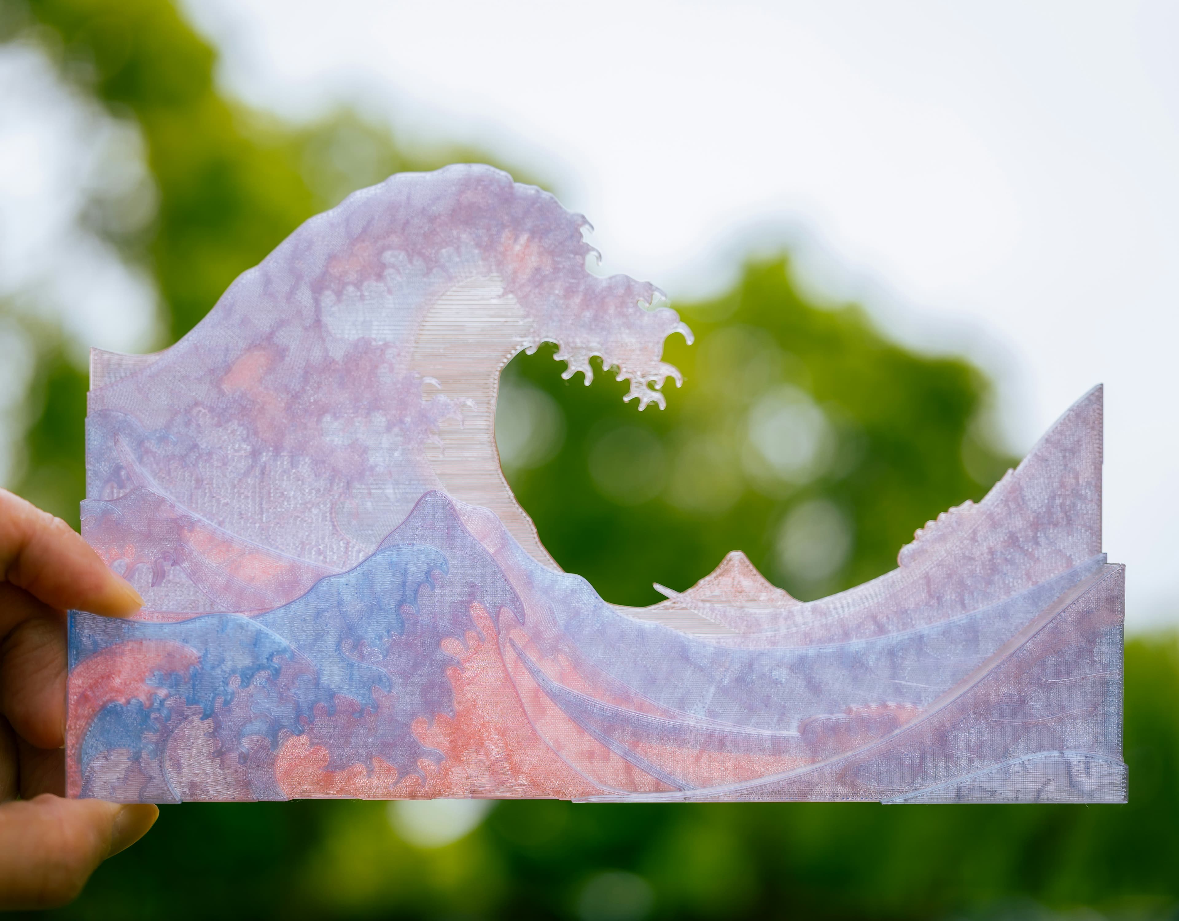 3D printed wave art with vibrant colors